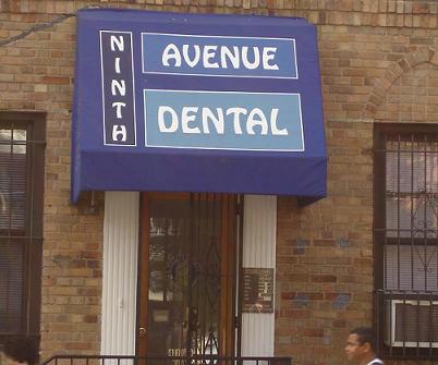 The image shows a storefront with a blue sign that reads Avenue Dental above a blue awning.